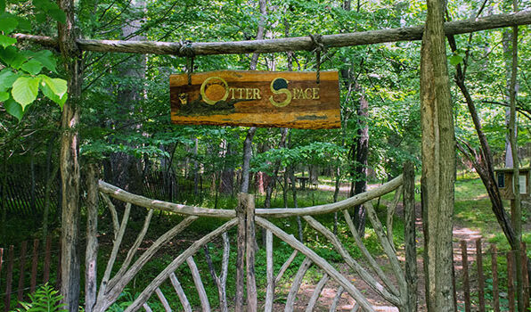 The rustic, wooden gate, to Otter Space